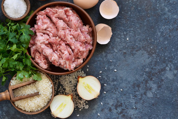 Cooking process of meat balls on the kitchen table. Ingredients for cooking meat. View from above.