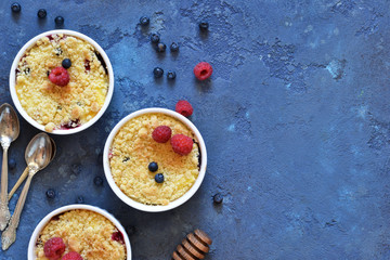 Crumble with berries, honey and almonds. View from above.