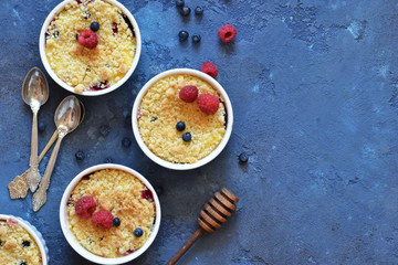 Crumble with berries, honey and almonds. View from above.