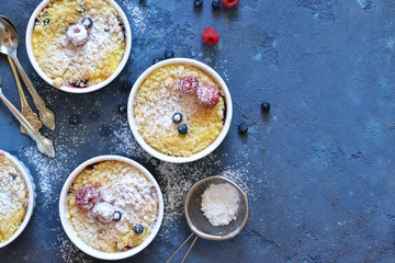 Vanilla cheesecake with berries on the kitchen table.