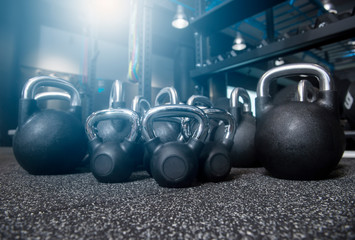 Obraz na płótnie Canvas Close-up kettlebell sports equipment weight on the floor