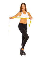 Young healthy girl doing exercises, full length portrait isolated over white background
