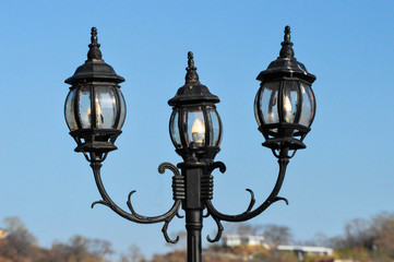Fototapeta na wymiar Triple lantern with sky background