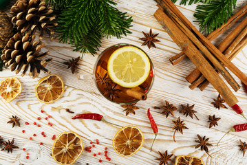 Winter drink with spices on festive new year background
