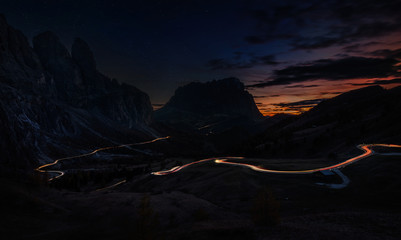 Traffic trails on mountain pass at night
