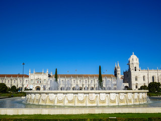 Fototapeta na wymiar Jeronimos Monastery in Lisbon - the most grandiose monument to late-Manueline Portuguese style architecture, and Church of Santa Maria of Belem in Lisbon, Portugal