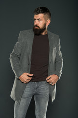 The confidence of best hair. Brutal guy with shaped beard and styled hair. Hairy hipster with stylish beard and mustache hair on grey background. Bearded man with unshaven face hair wear casual style