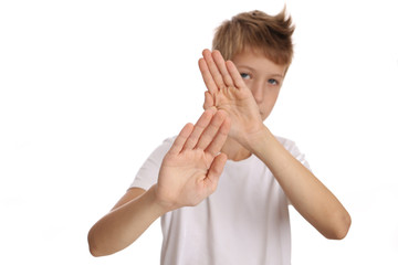 Teenage boy making no sign isolated on white background