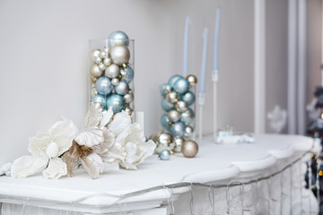 New Year's toys stand on the fireplace as decorations. Beautiful christmas background