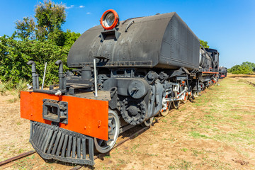 Old retro steel locomotive train standing on the rails in Livingstone, Zambia
