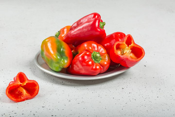 Sweet fresh red pepper with gray background