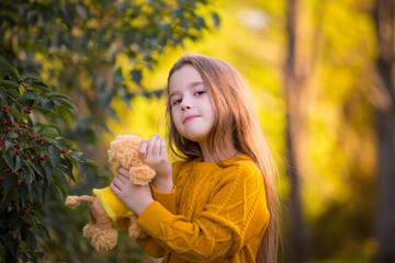  Girl, autumn, ginger color jumper, toy dog, fun