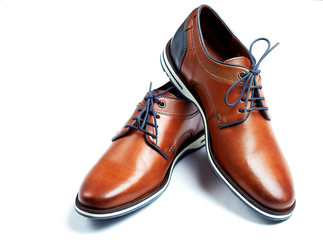 luxurious male brown and blue leather shoes isolated on a white
