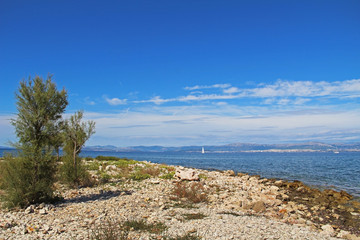 Fototapeta na wymiar Beautiful landscape of sea Coast of Adriatic sea with Transparent Blue Water near Supetar, Croatia. Popular travel destinations.
