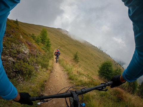 Two people mountain biking near Kals am Grossglockner, Lienz, Tyrol, Austria