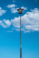 Fototapeta na wymiar Street light pole, galvanized steel stadium or park lamp pole, electricity or steel industry photo