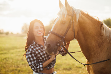 Young girl spending time with her horse