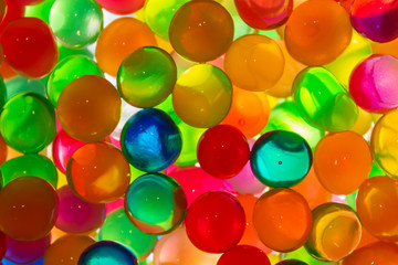 Colorful magic crystal glass jelly balls or bubbles against the light. Happiness concept