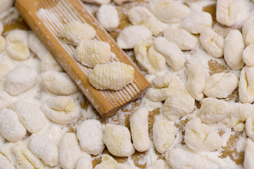 Cook homemade gnocchi on the table, Italian tradition