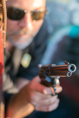 criminal holding a gun replica at gunfight
