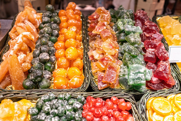 Candied fruits in famous market Boqueria in Barcelona of Spain