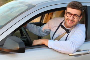 Posh driver wearing bowtie and suspenders 