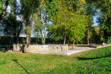 Scenic small brick wall and picnic area in Bundek city park, Zagreb, Croatia