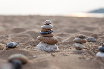stone sculpture on the beach, beautiful pebble tower