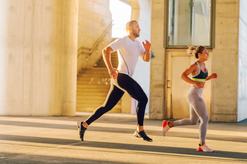 Couple running in an urban environment