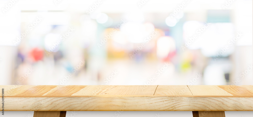 Poster empty wood table top with blur department store boekh background,mock up template for display or mon