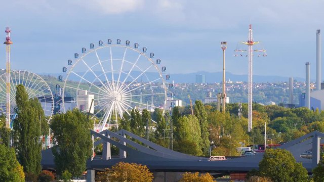 Stuttgart Cannstater Wasen Ferris wheel and other rides 4K panorama real time