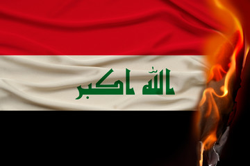 close-up photo of the burning national flag of Iraq State, concept of state crisis, destruction,...