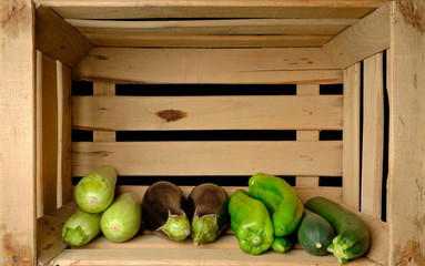 Old wooden fruit box with freshly picked fresh vegetables