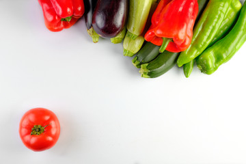 zucchinis , peppers red and green, eggplants, and tomato isolated