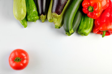 zucchinis , peppers red and green, eggplants, and tomato isolated