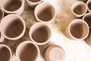 Obraz na płótnie Canvas Closeup of Variety of Prepared Clar Jars Located on Table in Workshop.