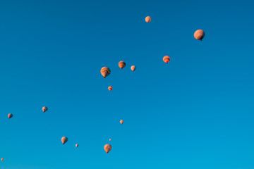 Many hot air balloons flying in Goreme, Cappadocia