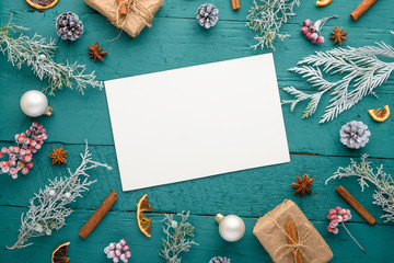 Christmas composition, frame, snow-covered branches of a Christmas tree. Cones. Giving with gifts. Atmosphere. New Year and holiday. Flat lay