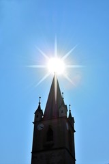 the sun on top of the church