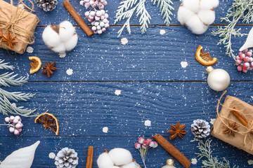 Christmas composition, frame, snow-covered branches of a Christmas tree. Cones. Cinnamon sticks. Atmosphere. New Year and holiday. Flat lay