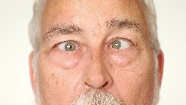 Senior man with googly eyes (independent eye motion)