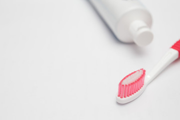 Toothbrush and toothpaste tube  on a white background