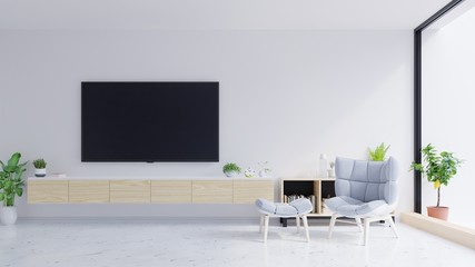 TV on the cabinet in modern living room with armchair on white wall background.