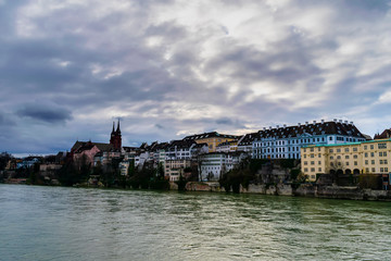 Obraz premium A river and a cathedral in Basel, Switzerland
