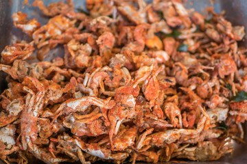 Close-up view of the crispy baby crabs selling in the food stall.