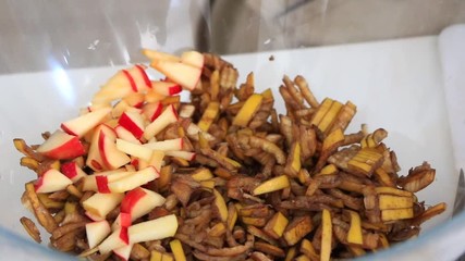 Apples and banana skin in a glass bowl. Cooking time. Mix of fuit chopped. Smoothie preparation in zero waste style. Vegetarian - Vegan dish. Healthy food. France. 