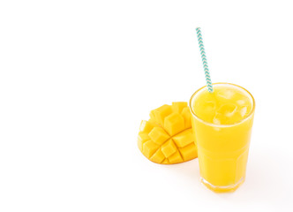 Fresh tropical mango juice with beautiful diced pulp and striped paper straw isolated on white background table, close up, cut out, clipping path.