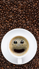 panoramic coffee background of a cup of black coffee with smiling face coffee bubble on background of roasted arabica coffee beans