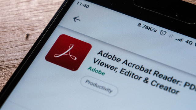 Magelang, Central Java, Indonesia, April 16, 2019. Adobe Acrobat Reader app in play store. close up on the Android Smartphones screen. - Image