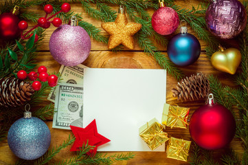 Christmas tree with decoration on a wooden board. Christmas toy. New year. Greeting card and dollars.